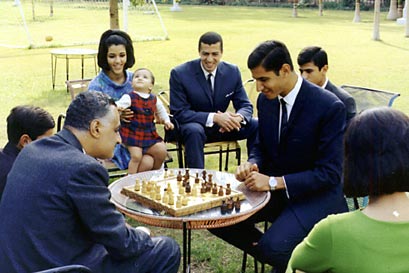 nasser in a chess game with his oldest son Khaled.jpg